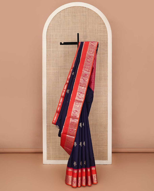 Blue zari buttas silk saree, contrast border of Muthu, rudraksham, mayil kann, poun, kamalam, manga and mayil and jaal pallu