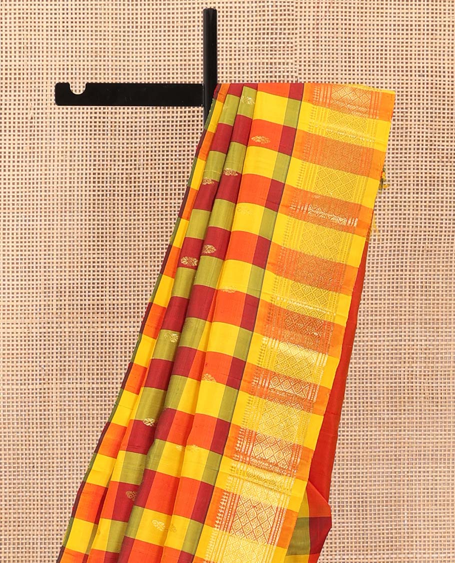 Multi-color checked and zari buttas Kanchipuram silk saree, one-sided border of paneer sombu, banaras, muthu, and jaal designs, and zari design pallu