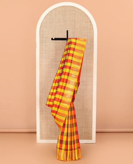 Multi-color checked and zari buttas Kanchipuram silk saree, one-sided border of paneer sombu, banaras, muthu, and jaal designs, and zari design pallu
