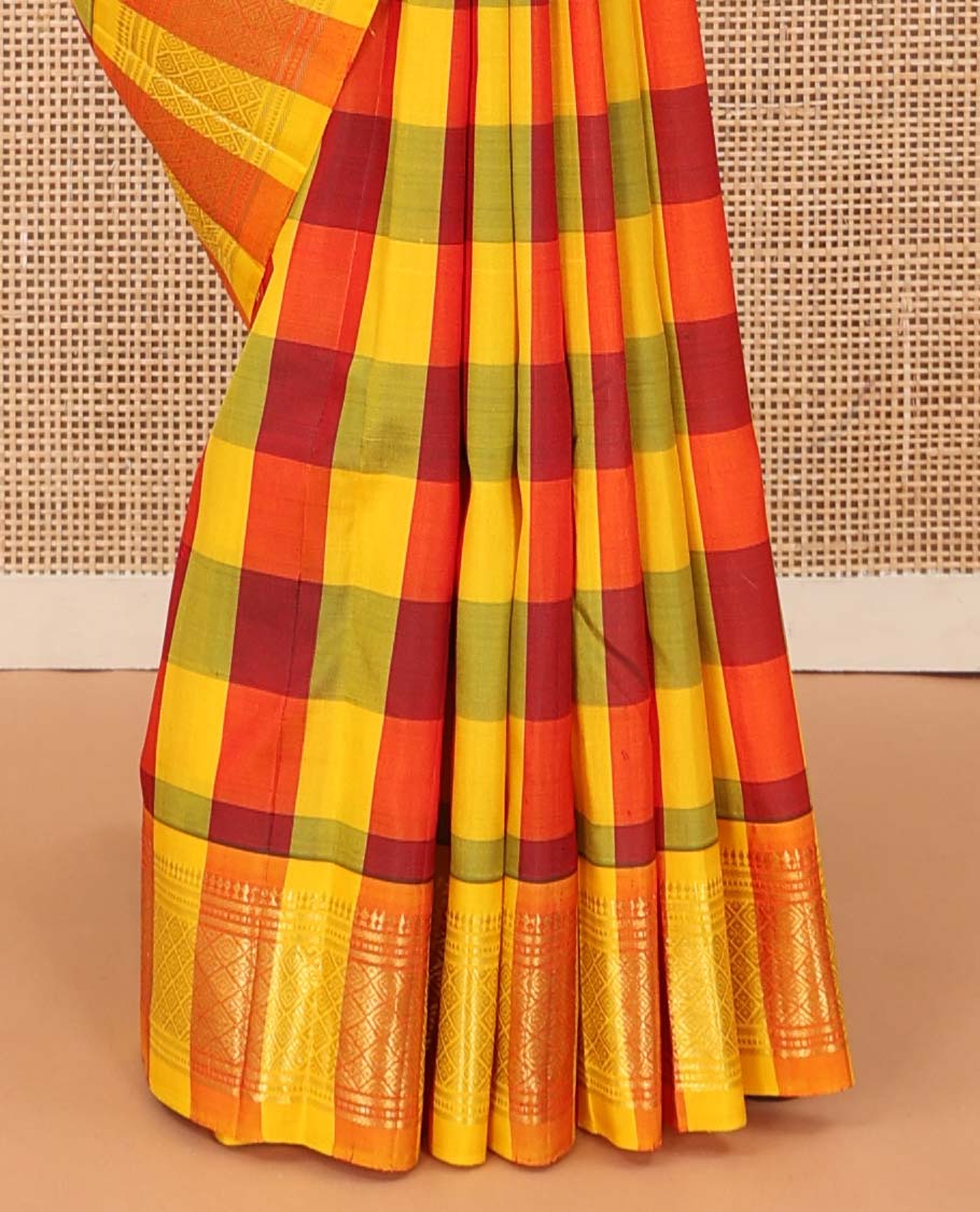 Multi-color checked and zari buttas Kanchipuram silk saree, one-sided border of paneer sombu, banaras, muthu, and jaal designs, and zari design pallu