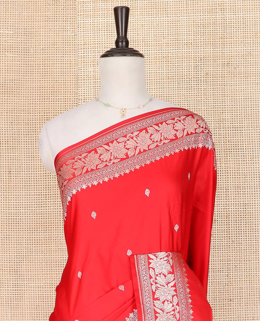 Red zari buttas mushru silk saree, self-border of floral creeper designs, and flower vase buttas woven pallu