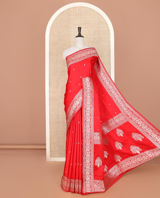 Red zari buttas mushru silk saree, self-border of floral creeper designs, and flower vase buttas woven pallu