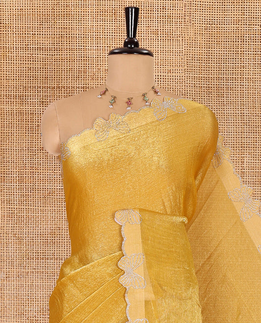 Yellow plain fendy chiffon saree, scallop border of butterfly motifs in stone work, self-pallu, and a matching blouse