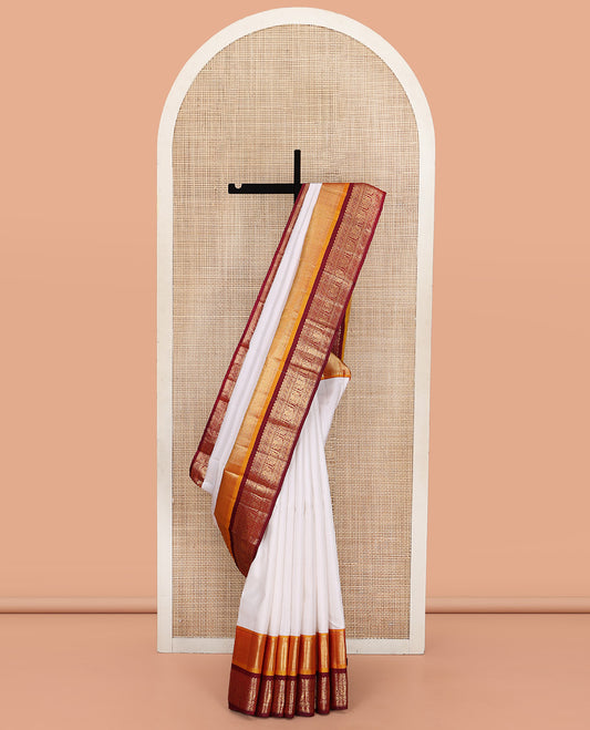 White Plain Vasundhara Silk Saree, Complemented by a Contrast Border of Muthu, Vanki, Rekku, Neli, Greek Key, and Iruthalai Pakshi Designs, Grand Jaal Pallu, and Paired with a Contrast Blouse