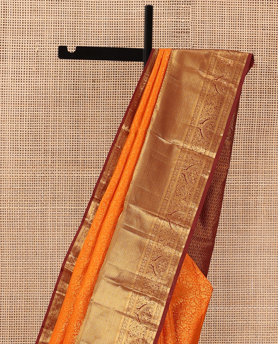 Orange jacquard wedding silk saree, contrast traditional zari design border, and zari-rich jaal pallu