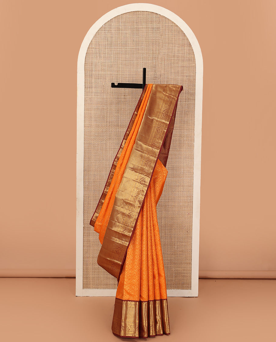 Orange jacquard wedding silk saree, contrast traditional zari design border, and zari-rich jaal pallu