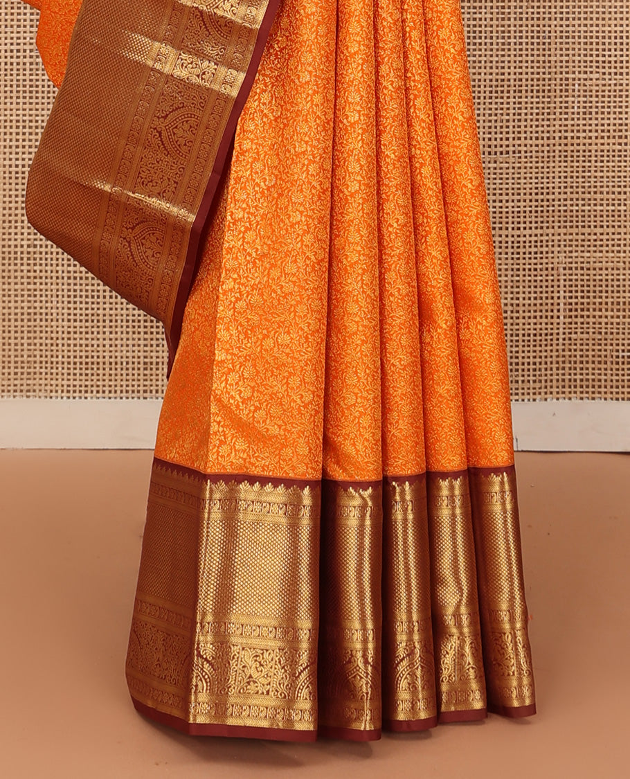 Orange jacquard wedding silk saree, contrast traditional zari design border, and zari-rich jaal pallu
