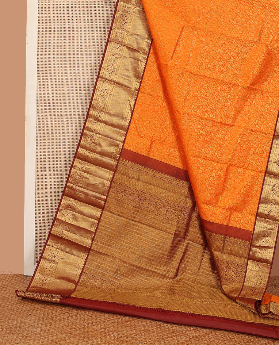 Orange jacquard wedding silk saree, contrast traditional zari design border, and zari-rich jaal pallu