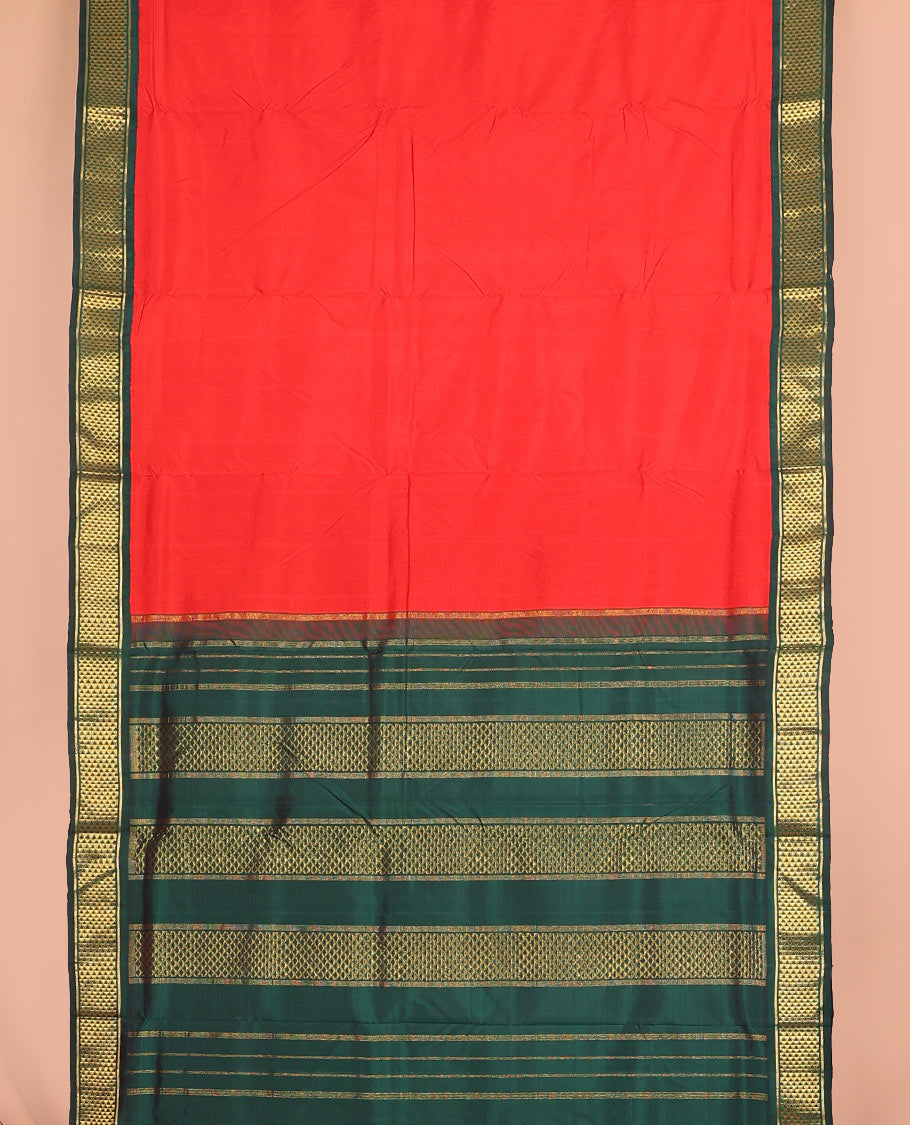 Red plain nine-yard silk saree, contrast ara maadam design korvai border, and pallu of ara maadam designs