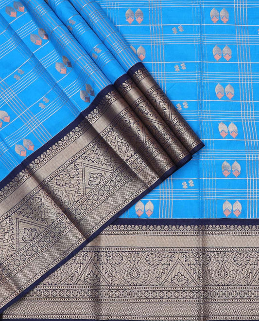Blue art silk pavadai material, zari butta enclosed checked with contrast traditional zari border skirt, and contrast blouse