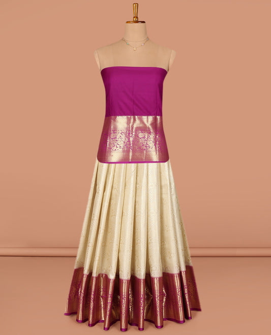 Cream Art Silk Pavadai Material Set, Mesmerized with Jacquard Design on Its Skirt, Complemented by a Contrast Traditional Zari Border of Floral Designs, and Paired with a Contrast Blouse
