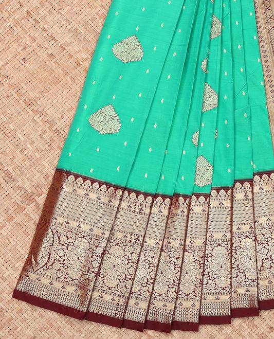 Green Budget Silk Saree, Accentuated with Zari Buttas on Its Body, Complemented by a Contrast Traditional Zari Design-Woven Border, Geometric Patterned Pallu, and Paired with a Contrast Blouse
