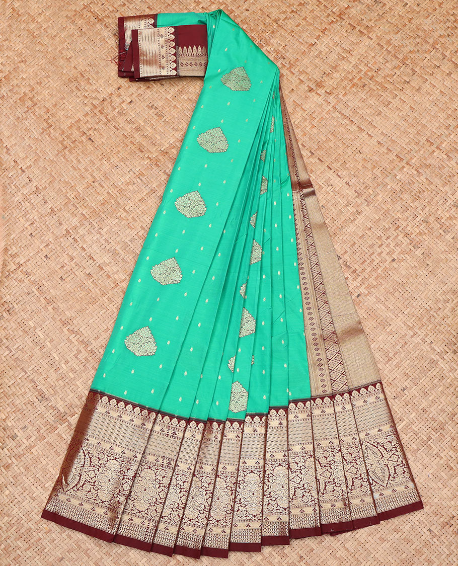 Green Budget Silk Saree, Accentuated with Zari Buttas on Its Body, Complemented by a Contrast Traditional Zari Design-Woven Border, Geometric Patterned Pallu, and Paired with a Contrast Blouse