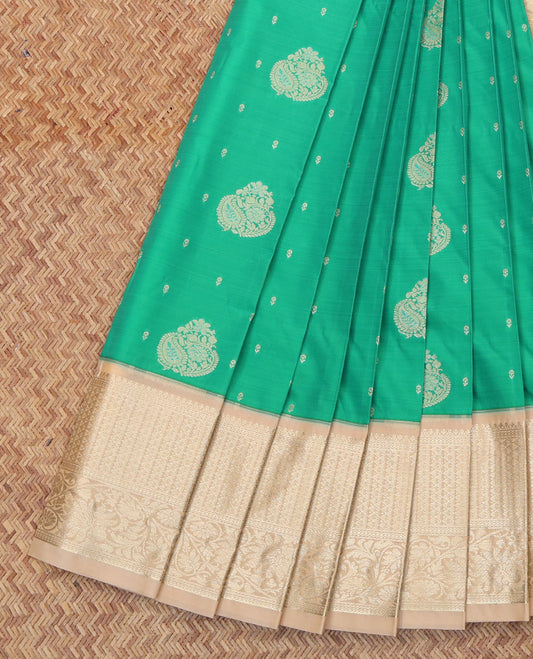 Green Budget Silk Saree, Detailed with Zari Buttas All Over Its Body, Complemented by a Contrast Traditional Zari Border, Pallu of Jaal and Paisleys, and Paired with a Contrast Blouse