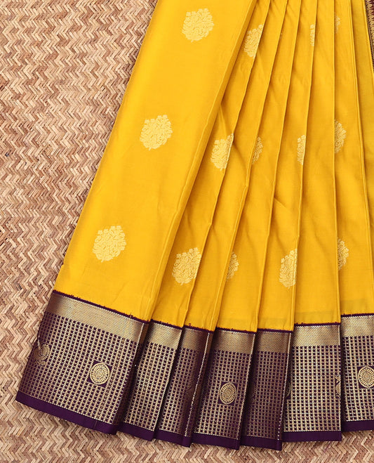 Yellow Budget Silk Saree, Bedecked with Zari Buttas All Over Its Body, Complemented by a Contrast  Zari Checked Border of Peacock-Chakram Designs, Grandly Woven Jaal Pallu, and Paired with a Contrast Blouse