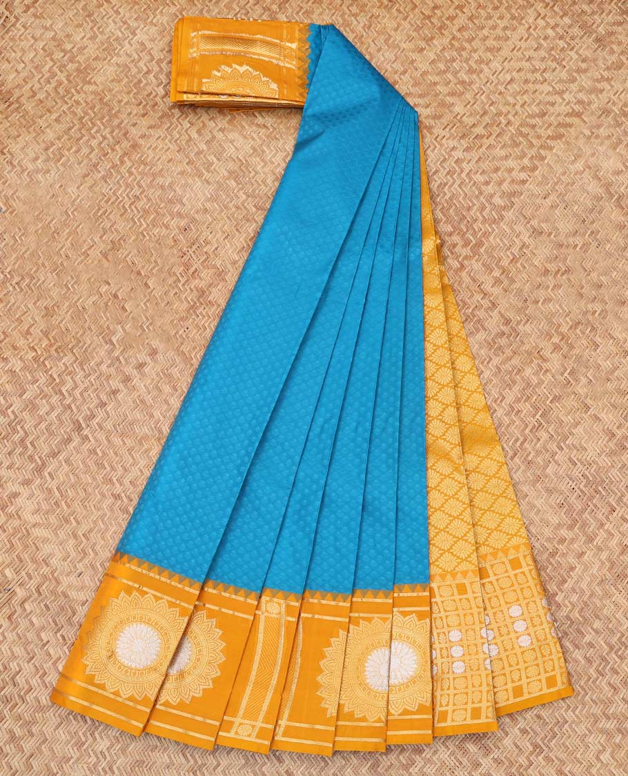 Blue Embossed Budget Silk Saree, Complemented by Contrast Floral Buttas Zari Border, a Grand Jaal Pallu and a Contrast Blouse