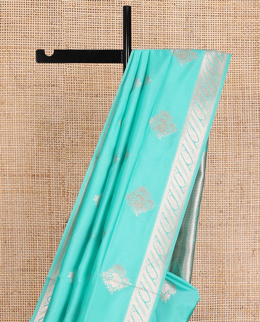 Turquoise butter silk saree with zari buttas, floral zari design border & intricate pallu