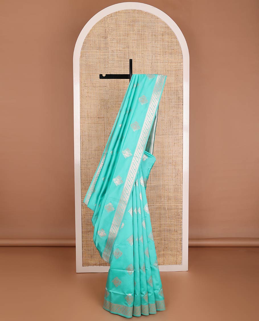Turquoise butter silk saree with zari buttas, floral zari design border & intricate pallu