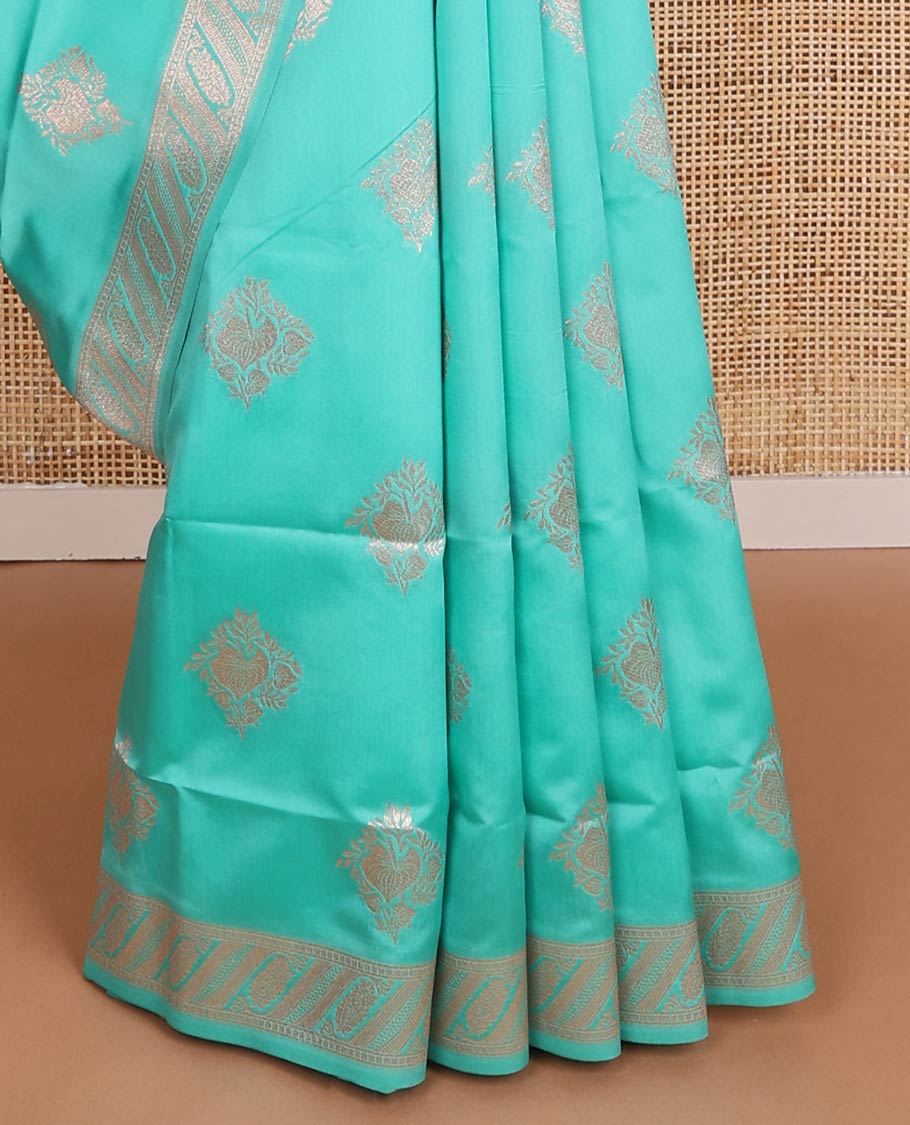 Turquoise butter silk saree with zari buttas, floral zari design border & intricate pallu