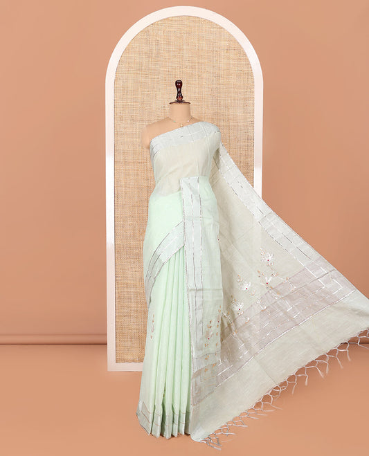 Green Tissue Cotton Saree, Bedecked with Floral Motifs Embroidery on Its Body, Subtle Gota Patti Striped Lace Border, Pallu Elevated with Floral Motifs Embroidery, and Paired with a Matching Blouse
