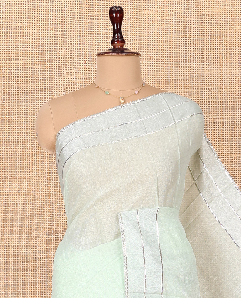 Green Tissue Cotton Saree, Bedecked with Floral Motifs Embroidery on Its Body, Subtle Gota Patti Striped Lace Border, Pallu Elevated with Floral Motifs Embroidery, and Paired with a Matching Blouse