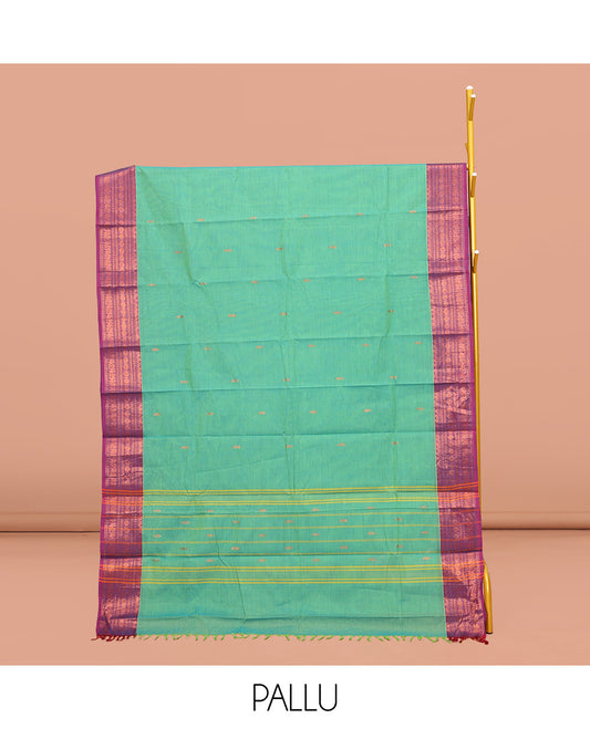 Green Chettinad Cotton Saree, Subtly Sparkled with Buttas All Over Its Body, Complemented by a Contrast Traditional Zari Design Border, Pallu of Stripes, and Paired with a Matching Blouse