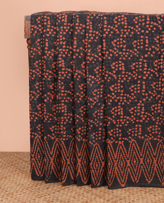 Black polka dots printed cotton saree, geometric printed border, and pallu