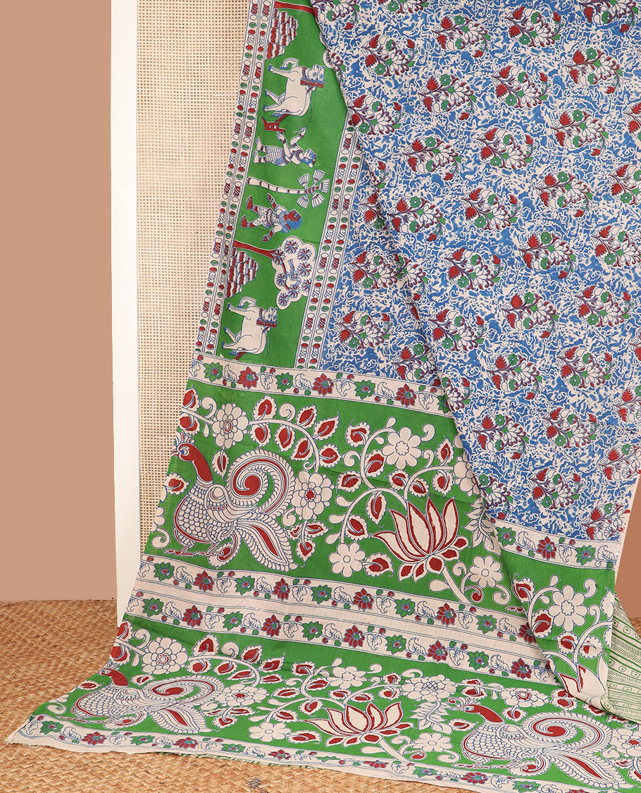 Blue floral machine-printed cotton saree, contrast farming-theme border, and pallu of lotus, floral and peacock print