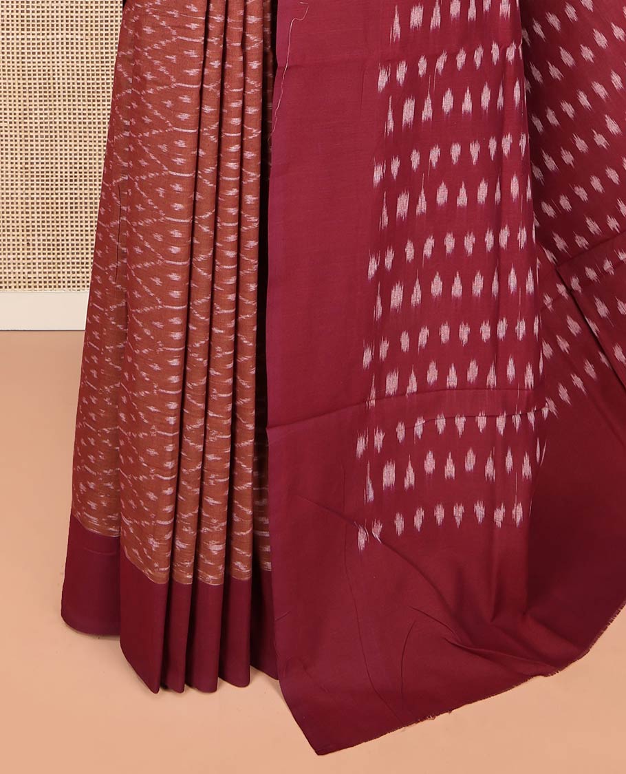 Brown Ikkat Cotton Saree, Steeped with Ikkat-Style Ogee Patterns on Its Body, Complemented by Contrast Border, Pallu Steeped with Ikkat Buttas, and Has No Blouse