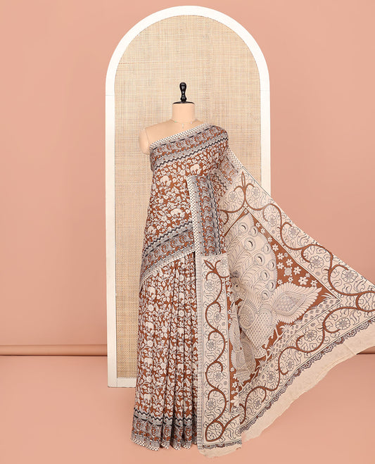 Brown Kalamkari Cotton Saree, Mesmerized with Flora-Fauna Print, Elephant Motifs Border, Pallu of Peacock Motifs, and a Matching Blouse