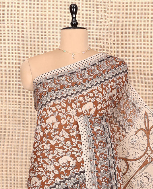 Brown Kalamkari Cotton Saree, Mesmerized with Flora-Fauna Print, Elephant Motifs Border, Pallu of Peacock Motifs, and a Matching Blouse