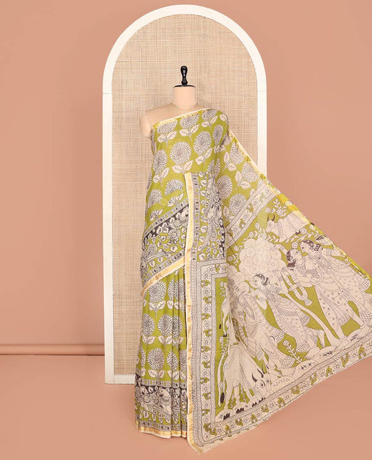Green Machine-Printed Kalamkari Cotton Saree Features Floral Motifs, a Piping Border, Pallu of Lord Krishna Motifs, and a Matching Blouse