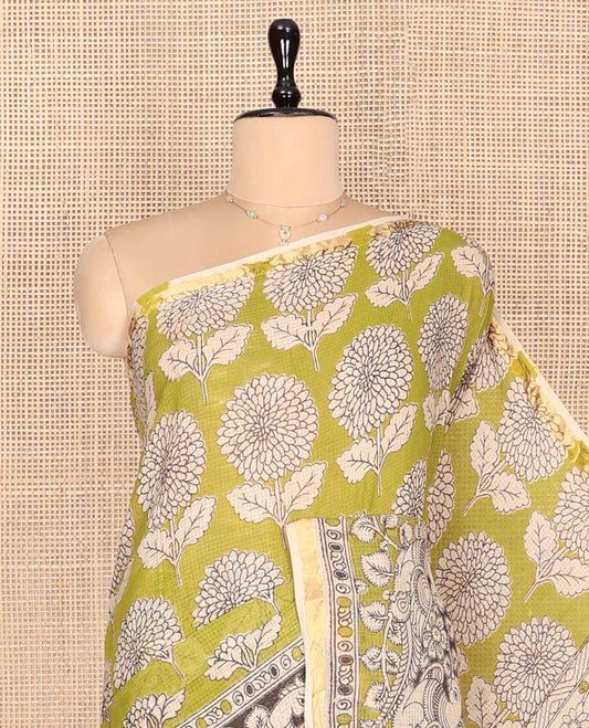 Green Machine-Printed Kalamkari Cotton Saree Features Floral Motifs, a Piping Border, Pallu of Lord Krishna Motifs, and a Matching Blouse
