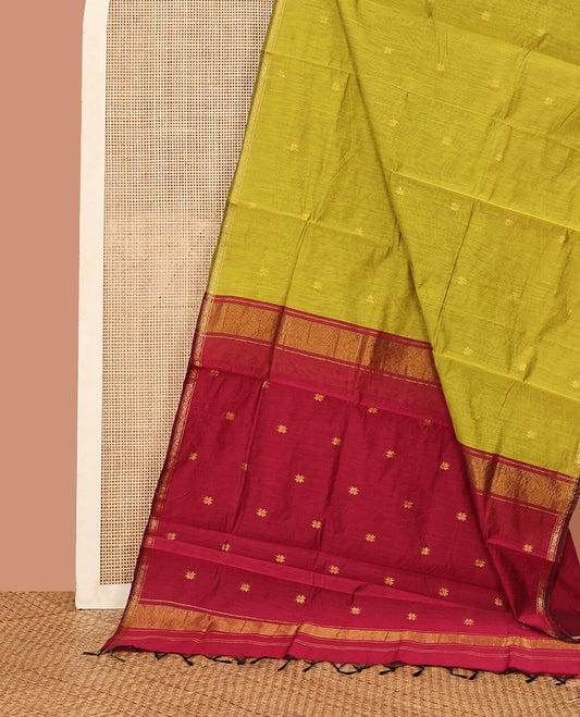 Green Maheshwari Cotton Saree, Delicately Woven with Flower Buttas All Over Its Body, Subtly Woven Piping Border, Captivating Contrast Pallu Steeped with Buttas, and Paired with a Contrast Blouse