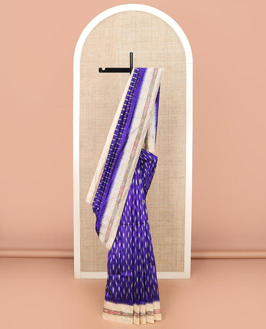 Blue Ikkat Silk Saree with Buttas Across the Body, Highlighted by a Contrast Ikkat-Textured Border, and Pallu Features Stripes and Ikkat Texture
