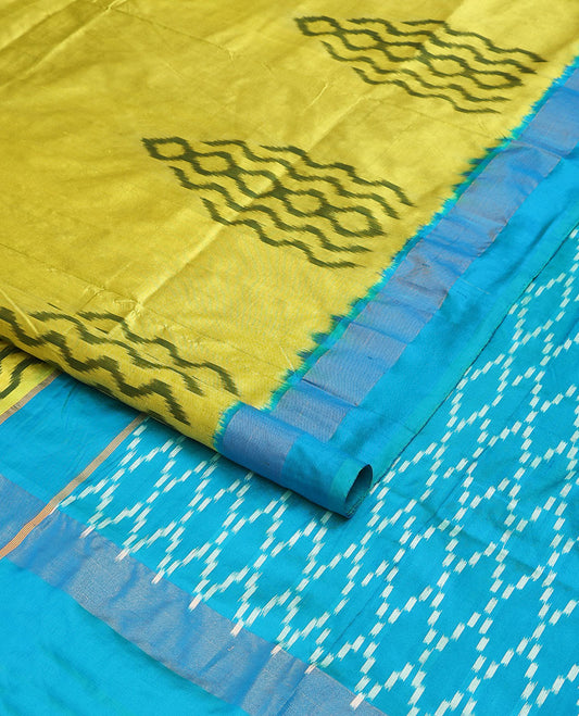 Green ikkat saree with ikkat buttas, contrast plain border & pallu of jaal design in ikkat weave