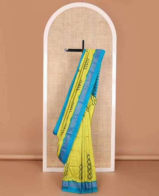 Green ikkat saree with ikkat buttas, contrast plain border & pallu of jaal design in ikkat weave