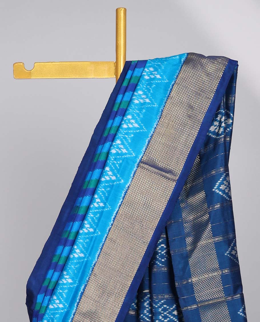 Blue striped ikkat silk saree with contrast zari border & floral design pallu