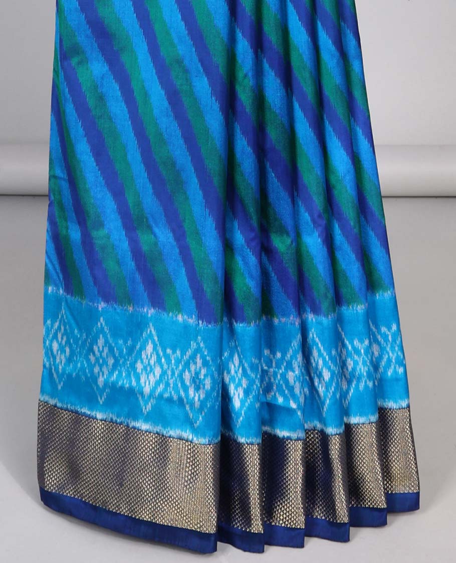 Blue striped ikkat silk saree with contrast zari border & floral design pallu