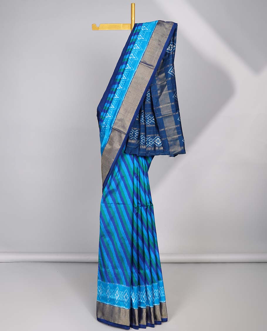 Blue striped ikkat silk saree with contrast zari border & floral design pallu