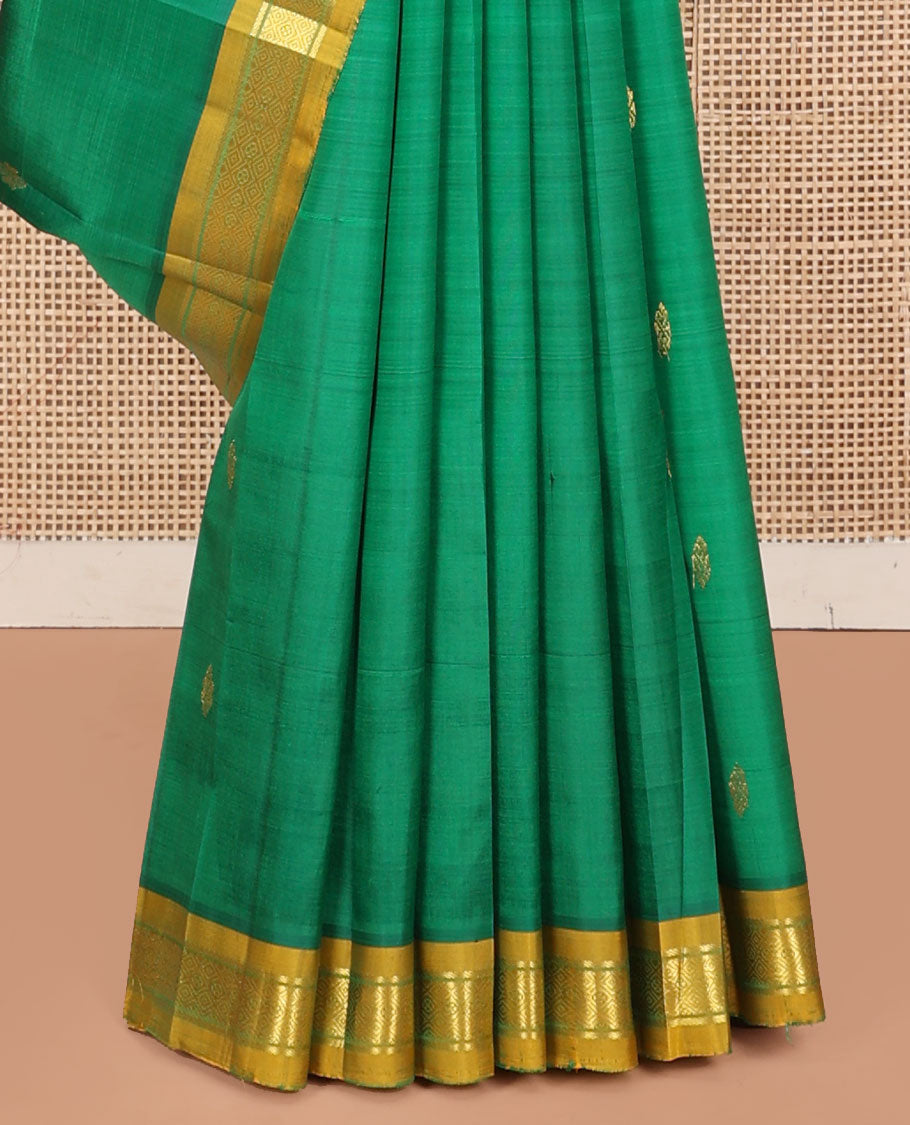 Green Kanchipuram Silk Saree, Decked Up with Zari Buttas, a Contrast One-Sided Border of Banaras and Muthu Design, Zari Design Pallu, and No Blouse