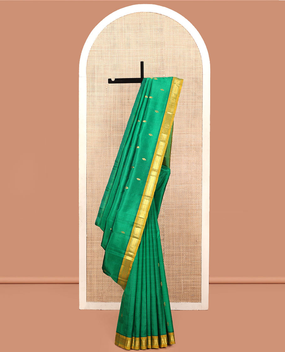 Green Kanchipuram Silk Saree, Decked Up with Zari Buttas, a Contrast One-Sided Border of Banaras and Muthu Design, Zari Design Pallu, and No Blouse