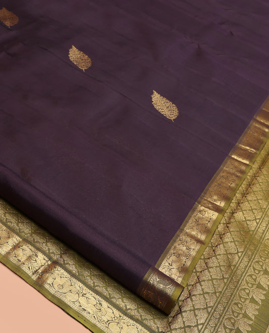 Brown Kanchipuram Silk Saree, Decked Up with Zari Buttas All Over Its Body, Complemented by Contrast Border of Manga and Mayil Designs, Grand Pallu, and Paired with a Contrast Blouse
