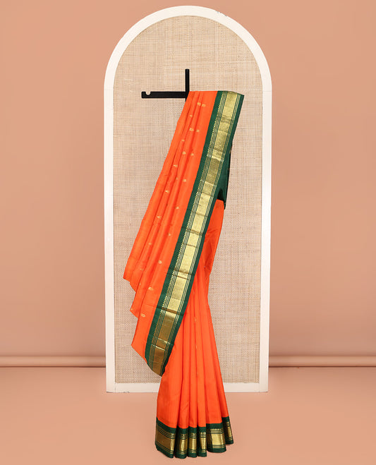 Orange Kanchipuram Silk Saree, Finely Crafted with Zari Buttas on Its Body, Complemented by a Contrast One-Sided Korvai Border of Rekku, Banaras, and Mayil Kann Designs, Pallu of Zari Designs, and Comes Without a Blouse