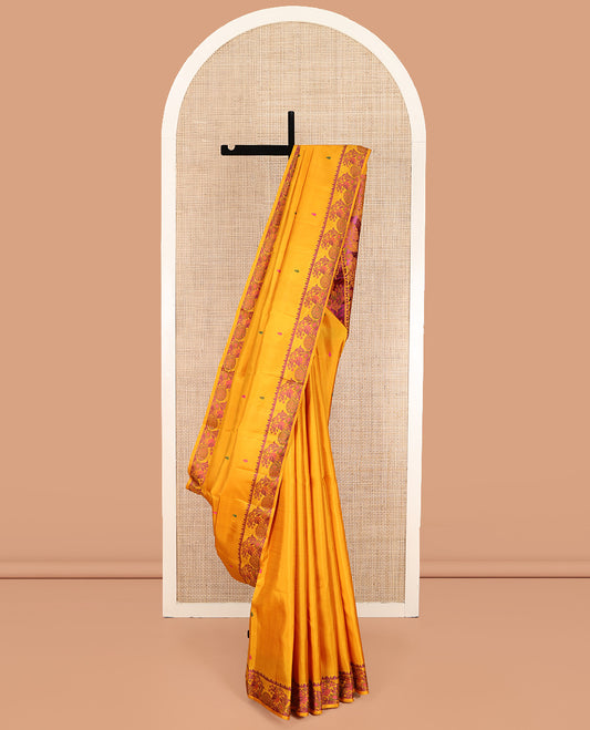 Yellow Kanchipuram Silk Saree, Delicately Woven with Thread Buttas All Over Its Body, Highlighted by a Self-Border of Thazampoo Rekku, and Mayil Designs, Pallu Steeped with Floral Designs, and Paired with a Matching Blouse