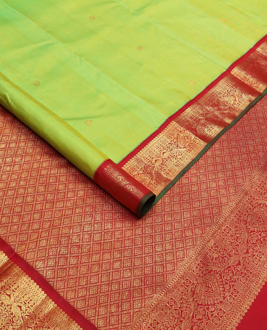 Green zari buttas Kanchipuram silk saree, contrast border of thilakam mokku, rettai neli, and mayil designs, and jaal design pallu
