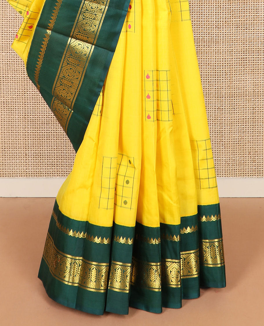 Yellow daayam kattam inspired motifs Kanchipuram silk saree, contrast korvai rettai pettu border of thilakam mokku, and manga designs, and pallu of mayil chariot designs