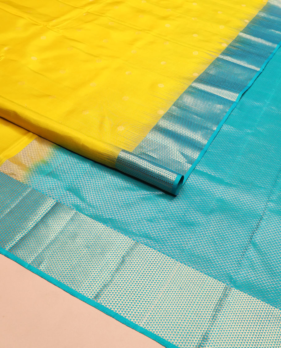 Yellow zari buttas Kanchipuram silk saree, contrast ara maadam design border, and pallu of ara maadam designs