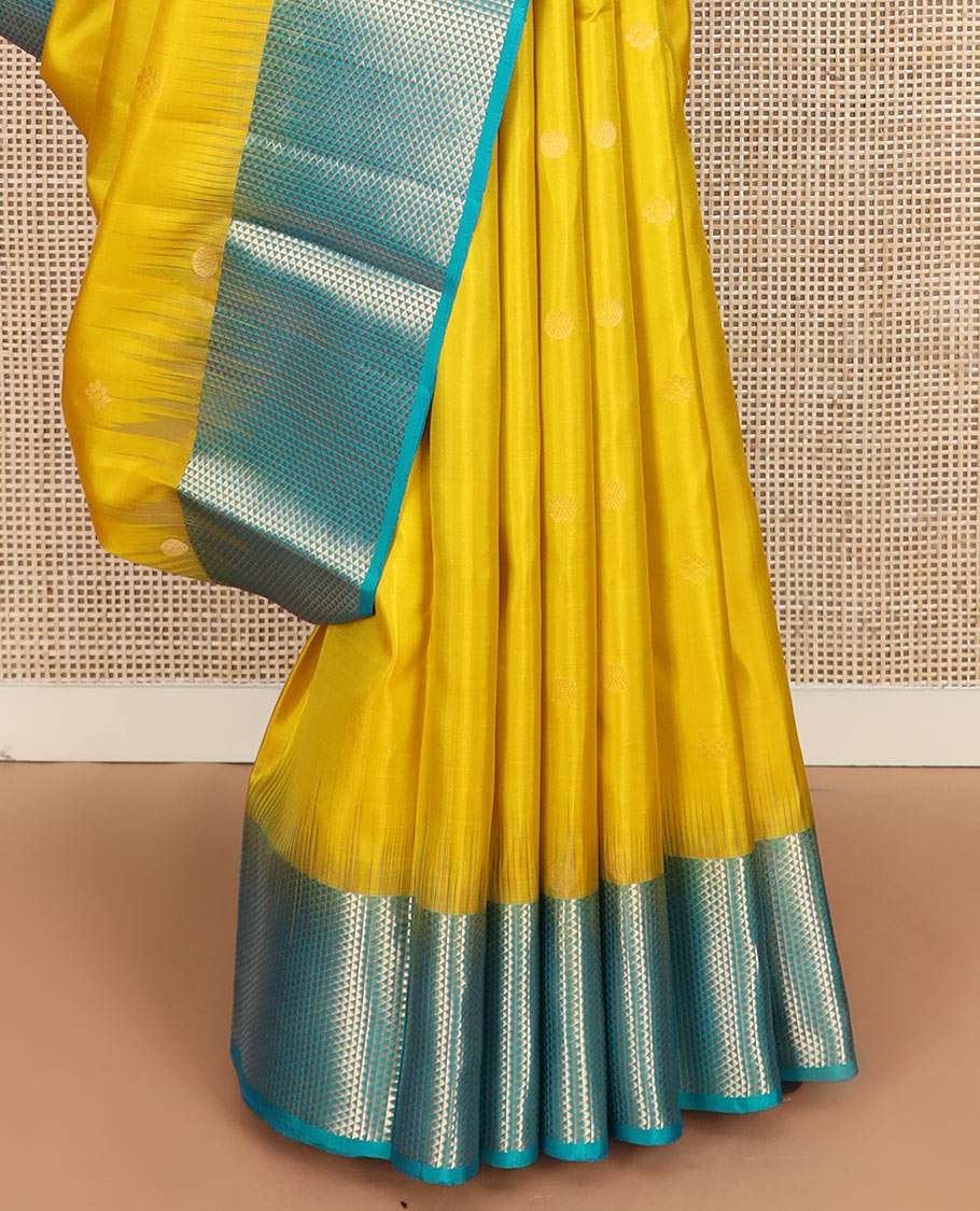 Yellow zari buttas Kanchipuram silk saree, contrast ara maadam design border, and pallu of ara maadam designs