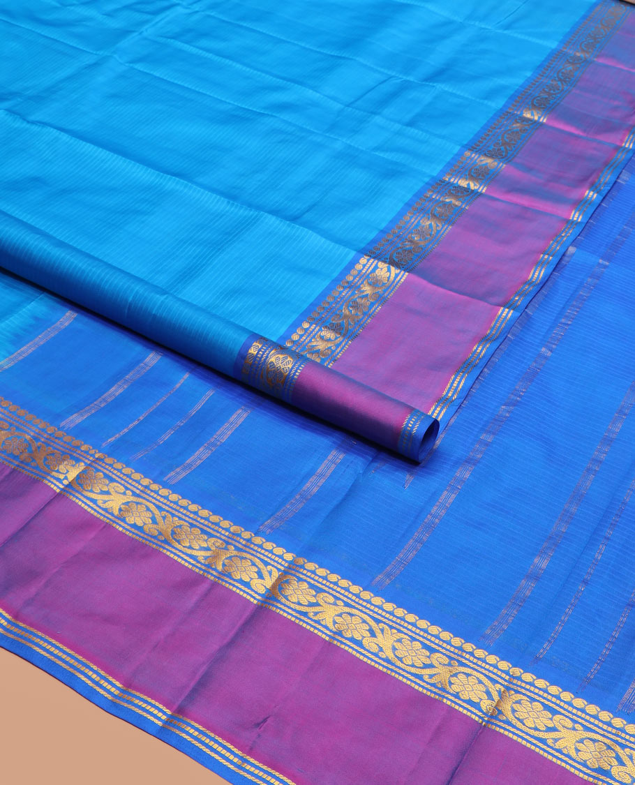 Blue Striped Kanchipuram Silk Saree Accentuated with Contrast Rettai Pettu Border Featuring Manga, Muthu, Banaras, and Kodi Visiry Designs, Subtly Woven Pallu with Stripes, and Paired with a Matching Blouse